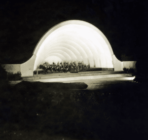 An old photograph of a concert hall at night.