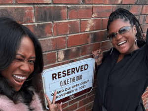 Case study: Two women standing next to a reserved sign off the street.