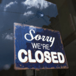 A sign that says sorry we're closed.