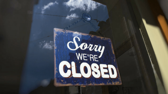 A sign that says sorry we're closed.