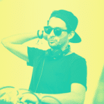 A dj wearing a hat and sunglasses in front of a green and yellow background.