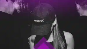 A woman in a purple hat and a man in a black hat.