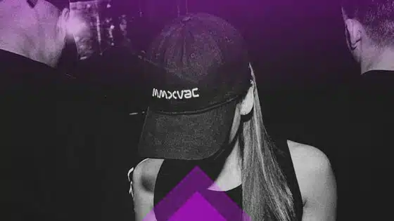 A woman in a purple hat and a man in a black hat.