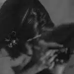 A black and white photo of a woman with headphones.