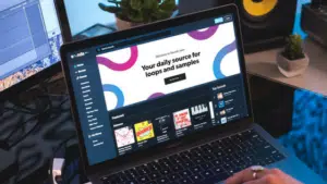 A person using a laptop on a desk.