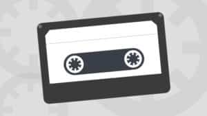 A cassette icon on a gray background.