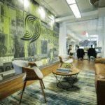 An office with a large mural on the wall.