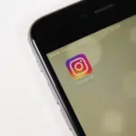 A smartphone with an instagram logo on it.