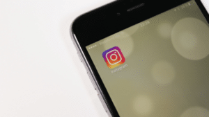 A smartphone with an instagram logo on it.