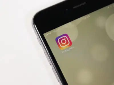 A smartphone with an instagram logo on it.