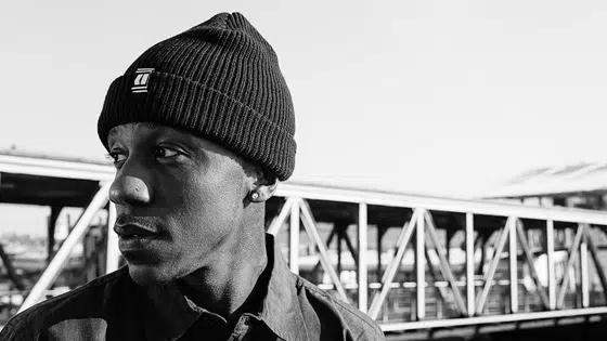 The man is wearing a black beanie.