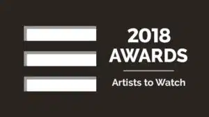 The 2018 awards artists to watch logo on a black background.