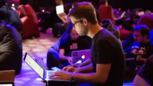 A group of people working on laptops at SXSW.