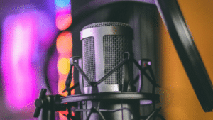 A microphone in front of a colorful background.