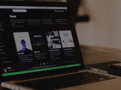 A laptop is sitting on a wooden table.