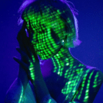 A woman with a green light on her face.