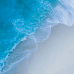 An aerial view of a beach and ocean.