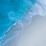 An aerial view of a beach and ocean.