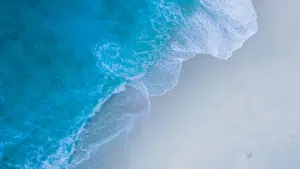 An aerial view of a beach and ocean.