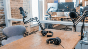 Two microphones on a table in an office.