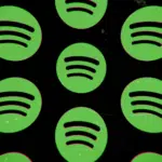 A green spotify logo on a black background.