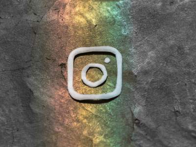 An instagram logo on a concrete wall.