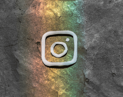 An instagram logo on a concrete wall.