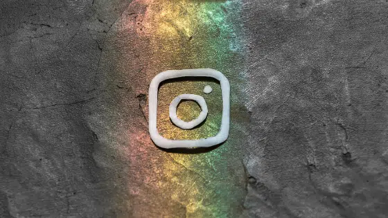 An instagram logo on a concrete wall.