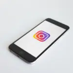 A smartphone with an instagram logo on it.