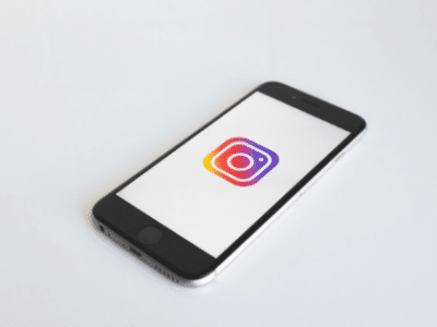 A smartphone with an instagram logo on it.