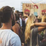 A crowd of people at a music festival.