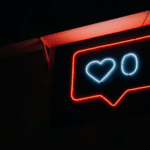 A neon sign with a heart on it.