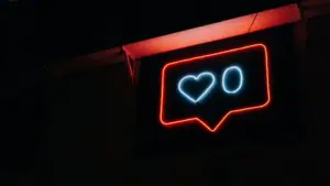 A neon sign with a heart on it.