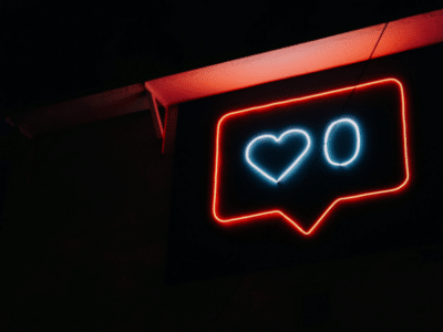 A neon sign with a heart on it.