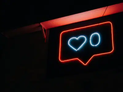 A neon sign with a heart on it.