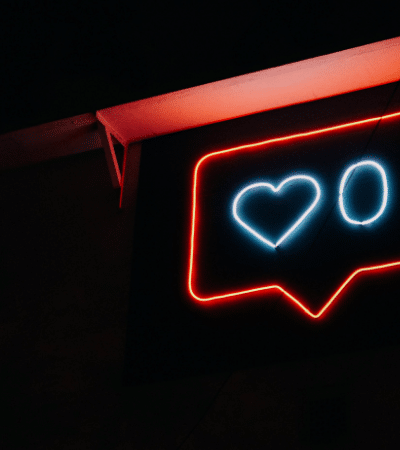 A neon sign with a heart on it.