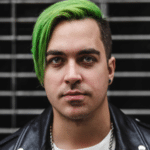 A man with green hair in a leather jacket.