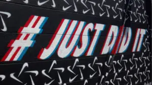 A wall with a sign that says just did it.