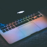 An image of a laptop in the dark.