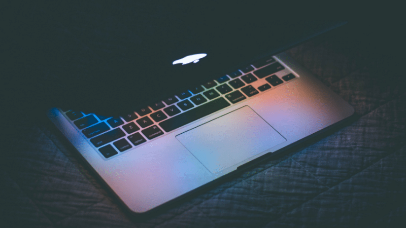 An image of a laptop in the dark.