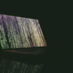 An image of a computer screen in the dark.