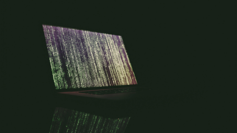 An image of a computer screen in the dark.