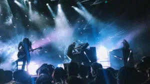 A group of people on stage at a concert.