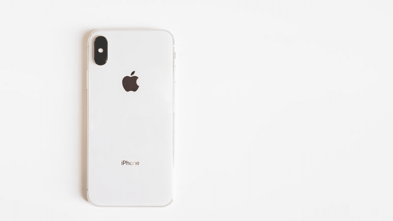 An iphone xr on a white surface.