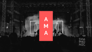 A black and white image of a concert with the words ama.