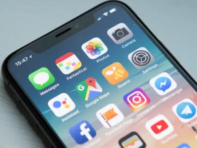 The iphone x is shown on a table.