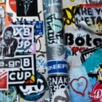 A wall adorned with trademark stickers.