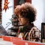 girl listening to music at a record store