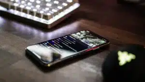 A cell phone on a desk demonstrating live streaming best practices.