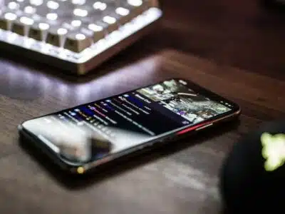 A cell phone on a desk demonstrating live streaming best practices.